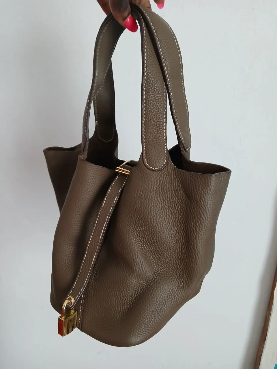 Hermès Picotin Lock 18 or 22 bag in Etoupe Taurillon Clemence leather with gold hardware.