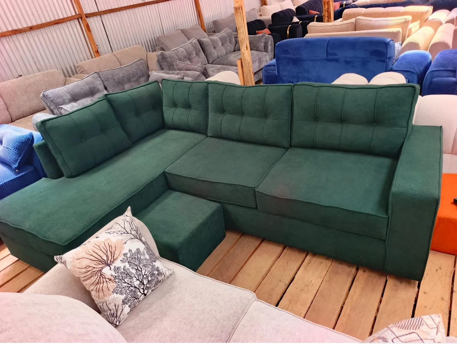 6-seater L-shaped sectional couch with an ottoman (Green)
